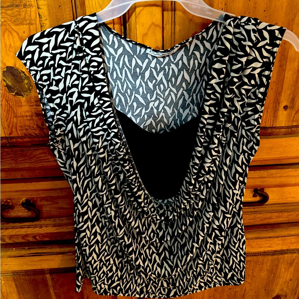 Loved this blouse. No longer fits. So comfortable and light.